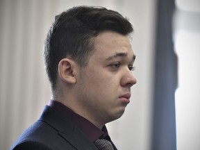 FILE - Kyle Rittenhouse keeps his composure while starting to cry as he is found not guilty on all counts on Nov. 19, 2021, at the Kenosha County Courthouse in Kenosha, Wis. A federal judge in Wisconsin on Wednesday, Feb. 1, 2023, ruled that a civil rights wrongful death lawsuit filed by the father of a man shot and killed by Rittenhouse during a protest in 2020 can proceed against city officials, police officers, Rittenhouse and others.