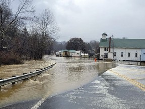 Floodwaters cover a road Friday, Feb. 17, 2023, in Pax, W.Va. The flooding came amid a string of thunderstorms that swept across the South.