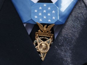 FILE - The Medal of Honor is seen around the neck of Medal of Honor recipient Army Staff Sgt. David Bellavia outside the West Wing of the White House in Washington, June 25, 2019. One of the first Black officers to lead a Special Forces team in combat will receive the Medal of Honor, the nation's highest award for bravery on the battlefield, nearly 60 years after he distinguished himself during the Vietnam War. President Joe Biden telephoned ret. U.S. Army Col. Paris Davis on Monday, Feb. 13, 2023, "to inform him that he will receive the Medal of Honor for his remarkable heroism during the Vietnam War."