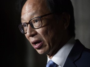 Sen. Yuen Pau Woo, facilitator of the Independent Senators Group, speaks to reporters during a press conference in the Senate foyer on Parliament Hill in Ottawa on Tuesday, May 29, 2018. He says a prospective foreign influence registry must not be "overly broad" to avoid unfairly targeting members of the Chinese-Canadian community and other minority groups.
