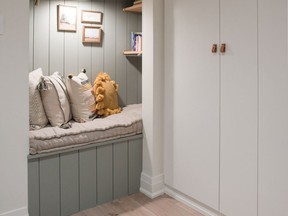 A closet was converted into a shiplap-trimmed reading nook.