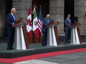 United States President Joe Biden and Prime Minister Justin Trudeau listen to Mexican President Andres Manuel Lopez Obrador speak during a joint news conference as they take their seats for a meeting at the at the North American Leaders Summit Tuesday, January 10, 2023 in Mexico City, Mexico.