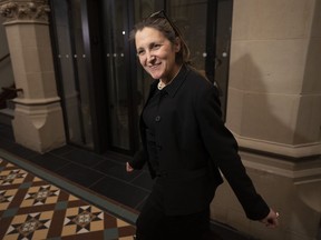 Deputy Prime Minister and Finance Minister Chrystia Freeland speaks briefly with reporters as she makes her way to a cabinet meeting, Tuesday, February 14, 2023 in Ottawa.