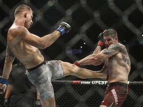 Marc-Andre Barriault is kicked by Krzysztof Jotko during UFC 240, in Edmonton on Saturday, July 27, 2019. Canadian middleweight Marc-Andre (Powerbar) Barriault looks to take advantage of a marquee stage Saturday when he takes on Julian (The Cuban Missile Crisis) Marquez on the undercard of UFC 285.&ampnbsp;THE CANADIAN PRESS/Jason Franson