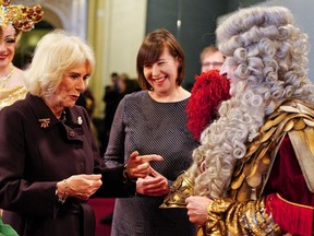 Queen Consort Camilla (left) visits the Komische Opera opera house in Berlin on March 30, 2023.