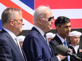 U.S. President Joe Biden is flanked by Australian Prime Minister Anthony Albanese, left, and British Prime Minister Rishi Sunak at a press conference about the AUKUS security pact, in San Diego, Calif., on March 13, 2023.