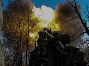 Ukrainian servicemen fire a self-propelled howitzer towards Russian troops outside the frontline town of Bakhmut, amid Russia's attack on Ukraine.