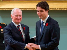 Prime Minister Justin Trudeau, right, shakes hands with Governor General David Johnston after being sworn in as prime minister in 2015.