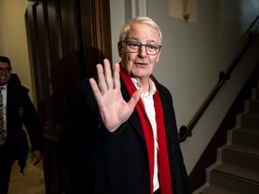 Liberal MP Marc Garneau waves as he passes journalists, as he leaves a caucus meeting on Parliament Hill in Ottawa, on Wednesday, March 8, 2023. THE CANADIAN PRESS/Justin Tang