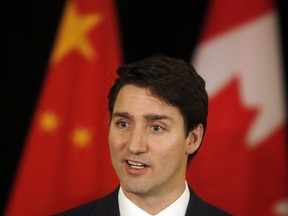 In this Dec. 5, 2017, photo, Prime Minister Justin Trudeau speaks to the media at a hotel in Beijing, China.