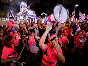 Israelis demonstrate during a "Day of Resistance" in Tel Aviv on Thursday, March 16, as Prime Minister Benjamin Netanyahu's coalition government presses on with a contentious judicial overhaul that would give the legislature unfettered power.