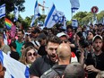 Israeli police confront protesters during a rally against the government's controversial judicial overhaul bill in Tel Aviv on March 16, 2023. The country's figurehead president, Isaac Herzog, has warned Israel is "within touching distance" of an abyss, and that civil war is possible over the issue.
