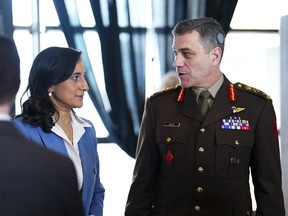 National Defence Minister Anita Anand speaks to Maj.-Gen Steve Boivin, commander of the Canadian Special Operations Forces Command, following an announcement at National Defence Headquarters in Ottawa on Tuesday, March 21, 2023.
