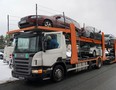 A trailer loaded with vehicles to send to Ukraine, which were confiscated from drunk drivers, in Riga, Latvia, March 8, 2023.