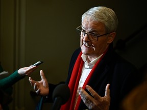 Liberal MP Marc Garneau speaks to reporters as he arrives for a caucus meeting on Parliament Hill in Ottawa, on Wednesday, March 8, 2023. THE CANADIAN PRESS/Justin Tang