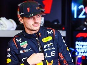 Max Verstappen of Oracle Red Bull Racing watches in the garage during practice ahead of the F1 Australian Grand Prix, on March 31, 2023 in Melbourne, Australia.