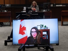 Katie Telford, chief of staff to Prime Minister Justin Trudeau, is seen on a television while appearing as a witness before the House of Commons Defence committee in May, 2021. Although Telford has testified before Commons committees a few times, in recent weeks the Liberals went all-out to prevent her from testifying about Chinese electoral interference on the grounds that staff shouldn't have to deliver committee testimony.