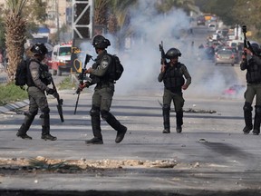 Israeli security forces clash with Palestinian youths during a military raid in the city of Jericho in the occupied West Bank on March 1, 2023. - Late on February 27, gunfire killed an Israeli-American man near Jericho, an attack the army blamed on suspected Palestinian attackers. Photo by AHMAD GHARABLI/AFP via Getty Images