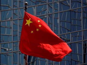 The Chinese national flag is seen in Beijing, China April 29, 2020. REUTERS/Thomas Peter/File Photo