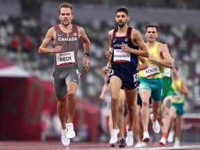 Canada's Nate Riech (left) and Redouane Hennouni-Bouzidi of France compete in the Men's 1500m - T38 Final on day 11 of the Tokyo 2020 Paralympic Games at the Olympic Stadium on Sept. 4, 2021 in Tokyo, Japan.