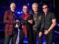The Edge, Bono, Adam Clayton and Larry Mullen Jr. of U2 in 2017. The group's members met in drummer Larry Mullen Jr.'s kitchen in 1976 after, looking to form a band, he posted an ad on a high school bulletin board.