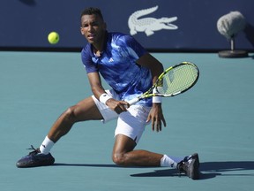Felix Auger Aliassime, of Canada, returns a volley against Thiago Monteiro, of Brazil, in the first set of a match at the Miami Open tennis tournament, in Miami Gardens, Fla., Saturday, March 25, 2023.&nbsp;Auger-Aliassime pulled out a tough 7-6 (5), 7-6 (8) win over Monteiro on Saturday to advance to the third round of the Miami Open.