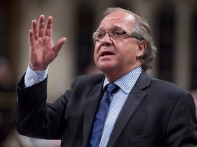 Aboriginal Affairs Minister Bernard Valcourt responds to a question during question period in the House of Commons, Tuesday, June 17, 2014, in Ottawa.Former federal Conservative cabinet minister Valcourt has pleaded not guilty to obstructing and resisting police.
