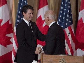 Prime Minister Justin Trudeau shakes hands with U.S. Vice-President Joe Biden after his address during a state dinner in Ottawa, Dec. 8, 2016.