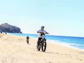An e-bike excursion on a beach in Los Cabos offered by Cabo Adventures is lets you experience the desert-meets-sea environment in the Baja Peninsula region of Mexico.