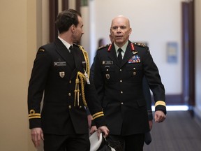 Canada's Chief of the Defence Staff Wayne Eyre makes his way to attend a cabinet meeting on Parliament Hill, in Ottawa, Tuesday, Feb. 14, 2023. The Department of National Defence says chief of the defence staff Gen. Wayne Eyre has just wrapped up a visit to Ukraine's capital.