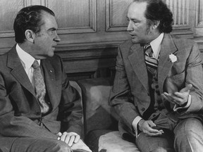 Richard Nixon and Pierre Elliott Trudeau talk in Trudeau’s Parliament Hill office in April 1972.  Chuck Mitchell / The Canadian Press files