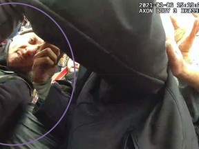 This image from the body-worn camera of Washington Metropolitan Police Department officer Michael Fanone shows Thomas Sibick, circled by the Justice Department, at left, during the riot at the U.S. Capitol on Jan. 6. Sibick pleaded guilty on Friday, March 3, 2023, to assault and theft charges for his role in the attack on Fanone. U.S. District Judge Amy Berman Jackson is scheduled to sentence Sibick on July 28. (Justice Department via AP)