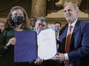 House Speaker Kevin McCarthy of Calif., stands with Denise Rucker Krepp, a former advisory neighborhood commission member, as he holds a ceremony to nullify the D.C. crime bill, Friday, March 10, 2023, on Capitol Hill in Washington.