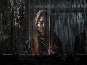 An Afghan woman weaves a carpet at a traditional carpet factory in Kabul, Afghanistan, Monday, March 6, 2023. After the Taliban came to power in Afghanistan, women have been deprived of many of their basic rights.