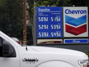 FILE - Chevron gas prices are displayed in Visalia, Calif., Tuesday, Nov. 16, 2021. State regulators say Chevron is the only one of the state's big five oil companies to not fully comply with a new state law requiring them to disclose data on pricing.