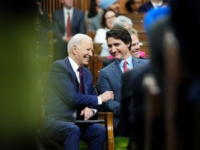 Prime Minister Justin Trudeau and U.S. President Joe Biden share a laugh after Biden's address to Parliament in the House of Commons, on Parliament Hill, in Ottawa, Friday, March 24, 2023. U.S. envoy David Cohen says Biden's visit was an authentic, intimate showcase of how important Canada continues to be to its southern neighbour.