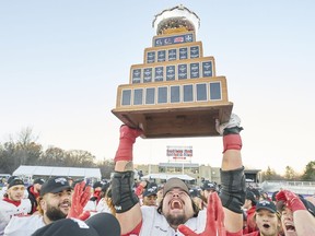 Laval's Antoine Dean Rios hoist the Vanier Cup following the Rouge et Or's victory over the Saskatchewan Huskies at Alumni Stadium in London, Ont., Saturday, Nov. 26, 2022.&ampnbsp;U Sports, Canadian university sport's governing body, announced Thursday its national championship football game will be played at Richardson Memorial Stadium, home of the Queen's Gaels, in 2023 and '24. THE&ampnbsp;CANADIAN PRESS/Geoff Robins