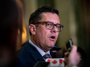 Saskatchewan Minister of Health Paul Merriman speaks to the media after the budget is presented in Regina, on Wednesday, March 22, 2023.