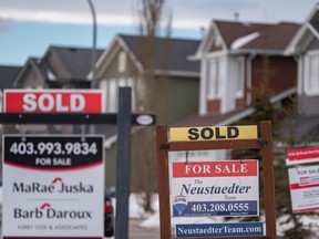 Real estate signs saying sold in Calgary.