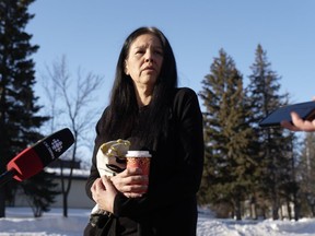 Odelia Quewezance speaks to media before a bail hearing outside Court of King's Bench in Yorkton, Sask. on Monday, March 27, 2023. Odelia Quewezance, 50, and her sister, Nerissa Quewezance, 48, (not pictured) were convicted of the second-degree murder of Kamsack, Sask., farmer Anthony Dolff in February 1993. A Saskatchewan judge has granted bail to the two sisters, who have spent nearly 30 years in prison for what they say are wrongful murder convictions.THE CANADIAN PRESS/Michael Bell
