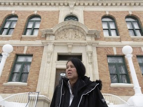 Odelia Quewezance speaks to media outside the Court of King's Bench in Yorkton, Sask., Tuesday, Jan. 17, 2023. A Saskatchewan judge is set to deliver his decision on whether to give bail to Quewezance and her sister Nerissa Quewezance. The two women have spent nearly 30 years in prison for what they say are wrongful murder convictions.