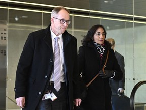 Defence Department deputy minister Bill Matthews and Minister of National Defence Anita Anand arrive to appear before the Standing Committee on National Defence in Ottawa on December 13, 2022.