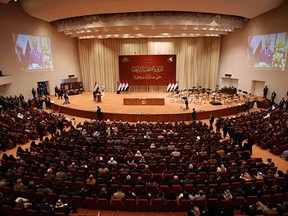 FILE - Iraqi lawmakers attend a parliament session in Baghdad, Iraq, on Sept. 3, 2018. Iraqi lawmakers passed early Monday March 27, 2023 a controversial amendment to the elections law that could hinder opportunities for smaller parties and independent candidates to win seats in future polls.