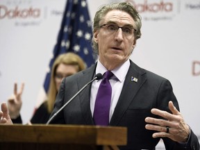 FILE - North Dakota Gov. Doug Burgum speaks at the state Capitol on April 10, 2020, in Bismarck, N.D. Burgum on Thursday, March 30, 2023, vetoed a bill that would prohibit public schools teachers and staff from referring to transgender students by pronouns other than those reflecting the sex assigned to them at birth in most cases.