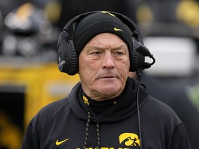 FILE - Iowa coach Kirk Ferentz stands on the field before the team's NCAA college football game against Wisconsin, Nov. 12, 2022, in Iowa City, Iowa. The attorney representing a dozen former Iowa football players who settled their racial discrimination lawsuit with the university's athletic department for over $4 million said Tuesday, March 7, that Black Hawkeye players will continue to be at risk of harassment "as long as Kirk Ferentz is in charge." Ferentz said Monday he was "greatly disappointed" in how the matter was resolved.
