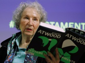 FILE - Canadian author Margaret Atwood holds a copy of her book "The Testaments," during a news conference, Sept. 10, 2019, in London. Filippo Bernardini, who impersonated hundreds of people over the course of the scheme that began around August 2016 and obtained more than a thousand manuscripts including from high-profile authors like Margaret Atwood and Ethan Hawke, was sentenced Thursday, March 13, 2023, in Manhattan federal court, after pleading guilty to one count of wire fraud in January. Bernardini was sentenced to time served, avoiding prison on a felony charge that carried up to 20 years in prison.