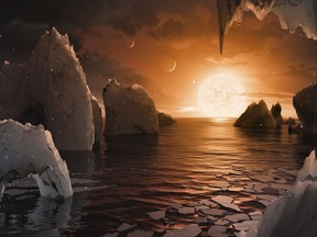 This image provided by NASA/JPL-Caltech shows an artist's conception of what the surface of the exoplanet TRAPPIST-1f may look like, based on available data about its diameter, mass and distances from the host star. The Webb Space Telescope has found no evidence of an atmosphere at one of the seven rocky, Earth-size worlds orbiting a nearby star. Scientists say that doesn't bode well for the rest of the planets in this solar system, some of which are in the sweet spot for harboring water and, therefore, life. In a study published Monday, March 27, 2023 a NASA-led team reported little if no atmosphere exists at the innermost planet in the Trappist system, 40 light-years away. (NASA/JPL-Caltech via AP)