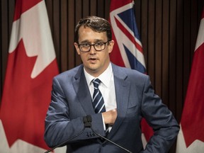 Ontario Labour Minister Monte McNaughton takes to the podium during a news conference in Toronto on Wednesday April 28, 2021.