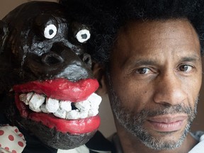 Artist Franck Sylvestre poses with puppet Max at his home in Montreal, Saturday, March 18, 2023. A theatre performance for children featuring a puppet that has been described as racist is continuing in the Montreal area. Several Black community organizations have criticized the puppet as being reminiscent of blackface minstrel shows.