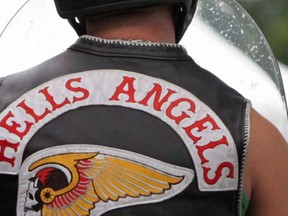 Members of the Hells Angels arrive at a property in Langley, B.C., on July 25, 2008.